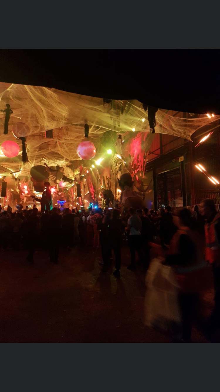 Crowded Halloween-themed event venue